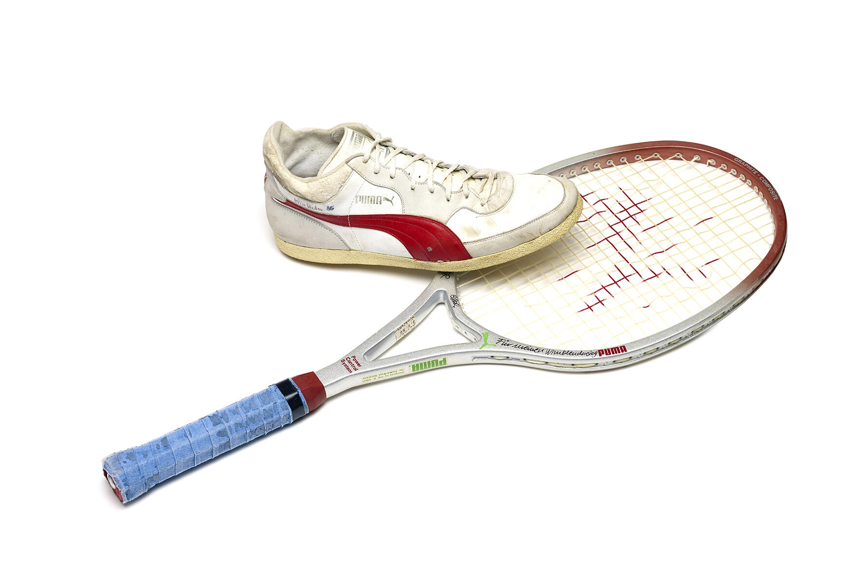 Picture of Boris Beckers tennis shoe and racket