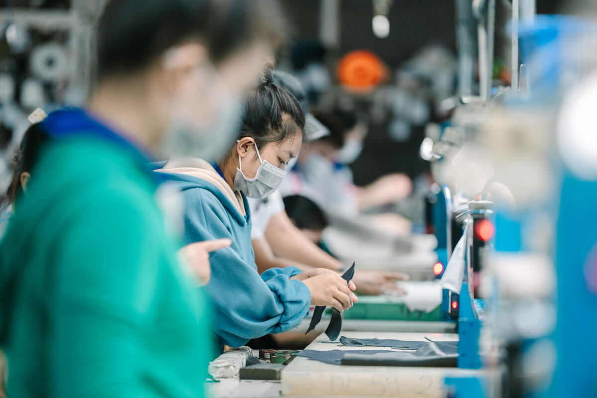 Factory workers at an assembly line