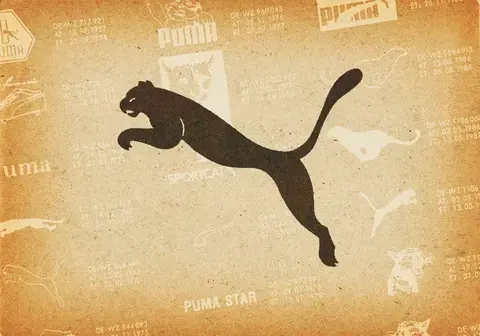 Vintage Puma-Logo mit der PUMA-Katze auf einem vergilbten, strukturierten Hintergrund.